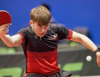 Larry Trumpauskas looks towards the ball after playing a shot with his right hand.