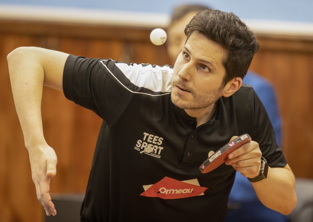 Oriol Monzo looks up a the ball as he plays a shot.