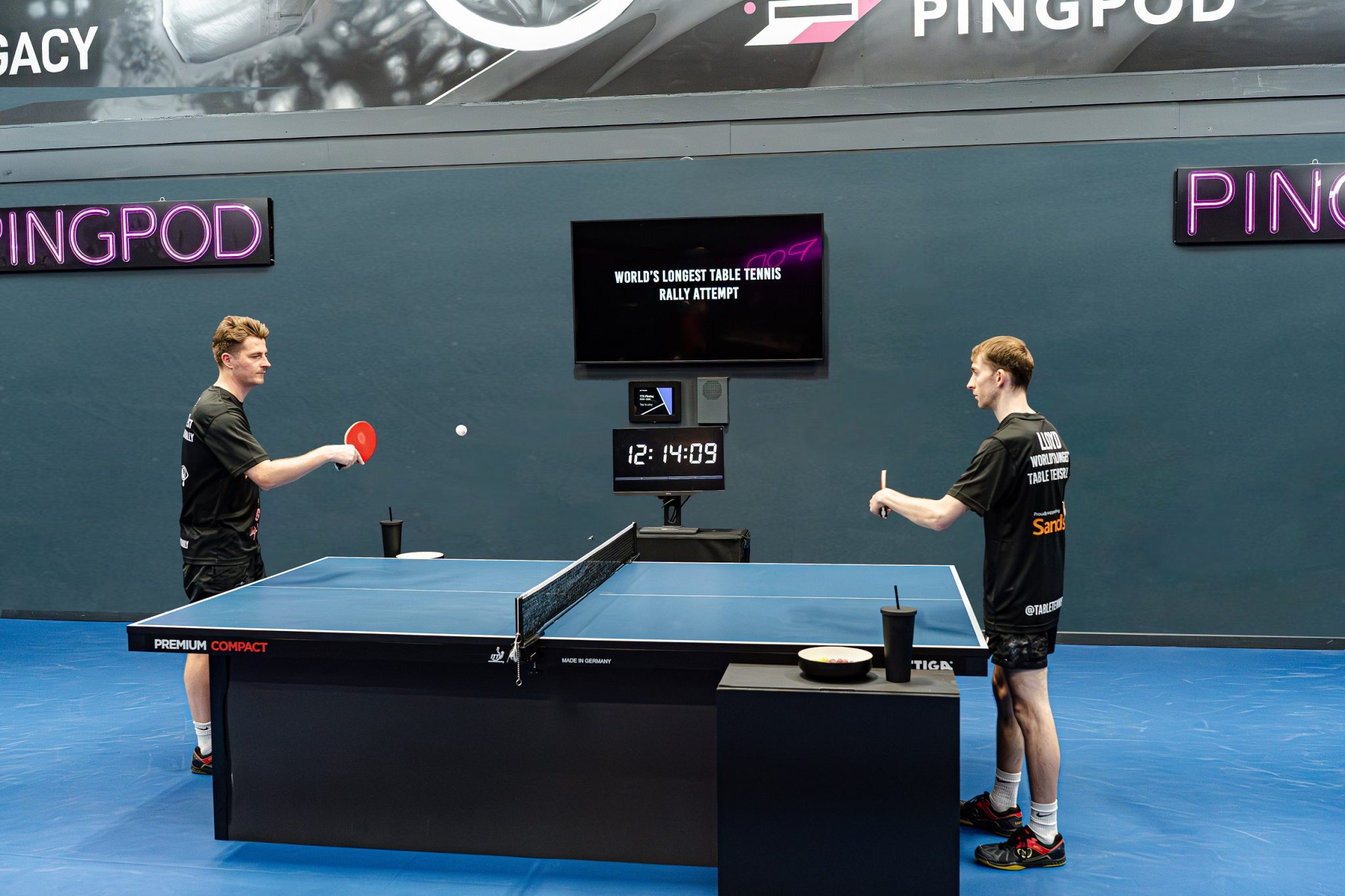 Dan and Lloyd on top of the world after breaking longest table tennis