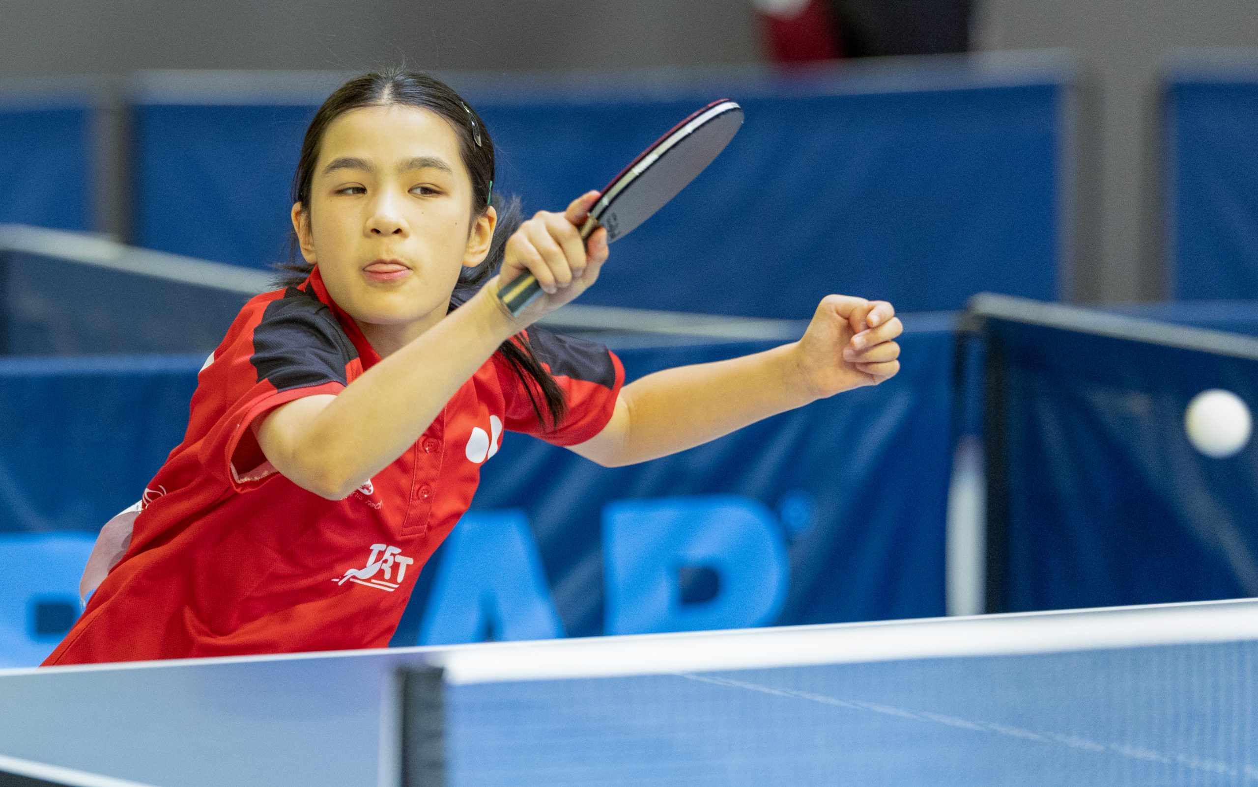 Alyssa Nguyan plays a table tennis shot