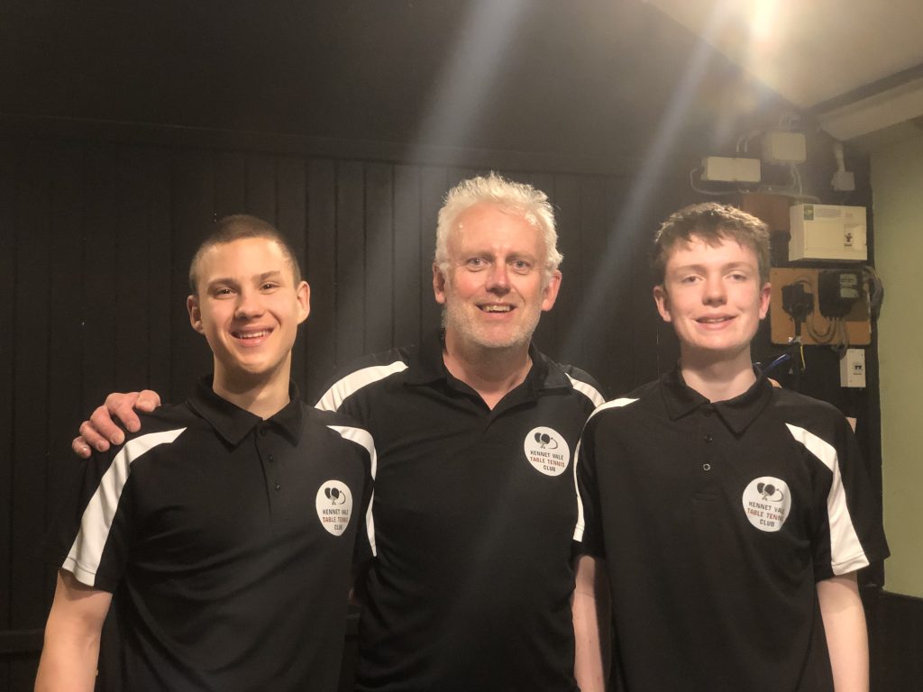 2 young table tennis players stand either side of their coach Richard Ramsden