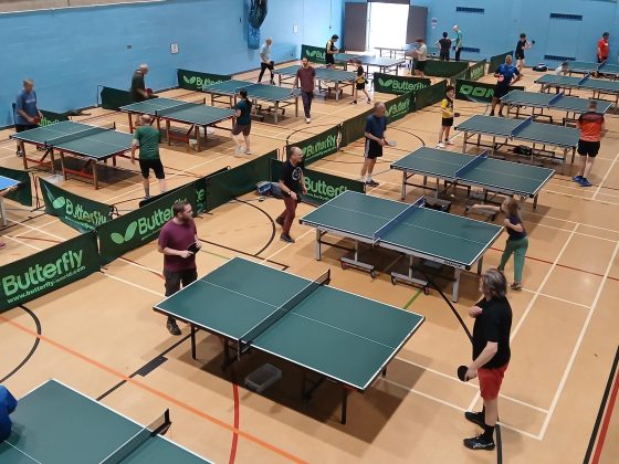 People playing table tennis in a leisure Centre